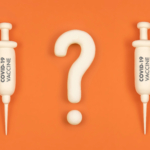 Vaccine hesitancy concept, syringes with vaccine and question ma