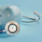 piggy bank and stethoscope on blue background, concept of medica