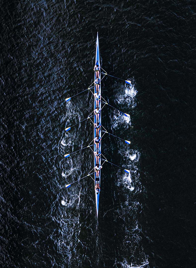 Men rowing on a river