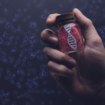 Close up of man holding DNA molecule in Glass bottle. Mixed medi