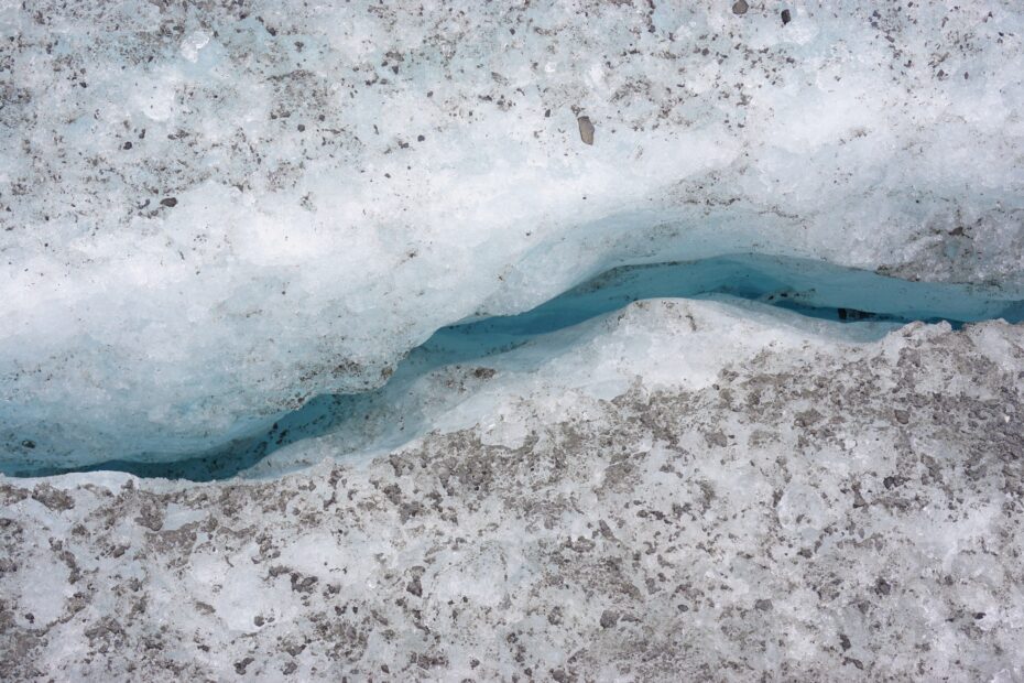 Cracks through the ice on a melting glacier in Alaska