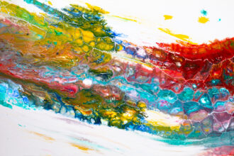 Abstract splash of rainbow colors swirled across a white canvas, with thick textured strokes and marbled patterns.